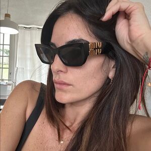 Miu Miu Black Sunglasses with Gold Detailing